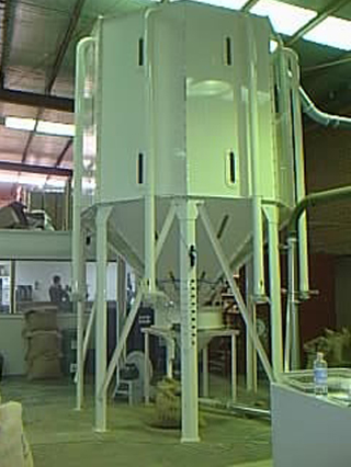 A Pneuvay segmented coffee silo for storing green beans. The discharge process is via a load cell arrangement that is used to blend beans of different varieties.
